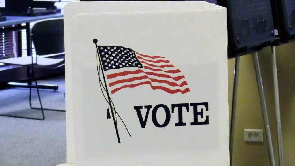 Vote sign with the American flag