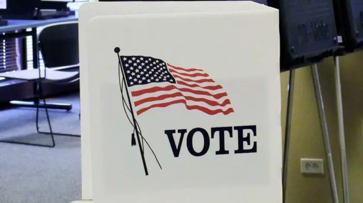 Vote sign with the American flag