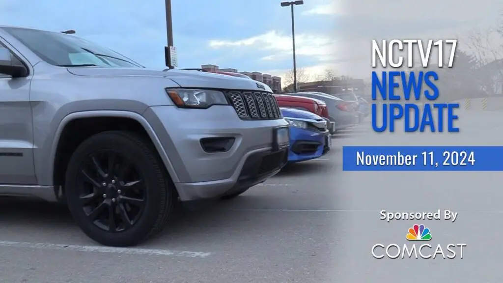 NCTV17 News Update slate for November 11, 2024 with cars parked at parking deck in background