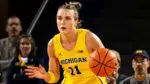 Naperville North alum, Greta Kampschroeder, takes the ball up for the University of Michigan.