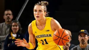 Naperville North alum, Greta Kampschroeder, takes the ball up for the University of Michigan.