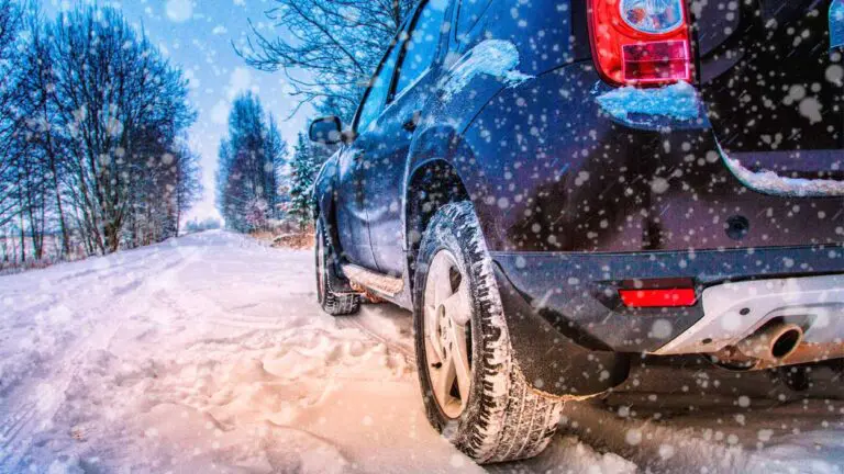 car driving through snow during the winter