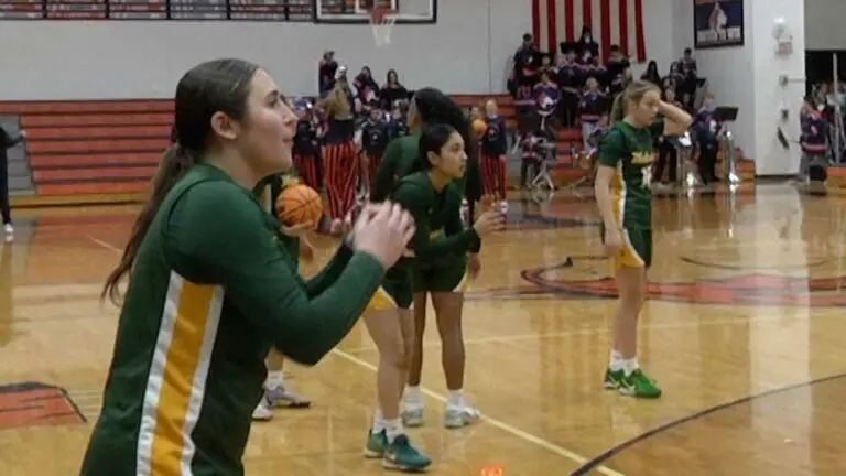 Waubonsie girls basketball players shoot around before the game against Naperville North.