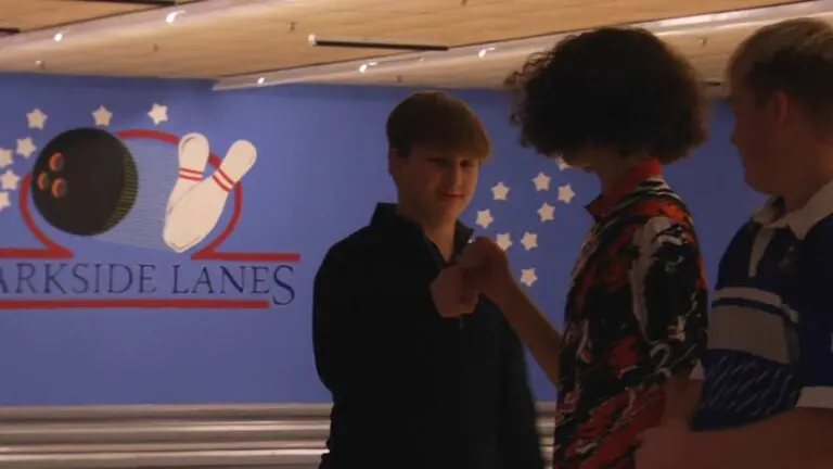 Alex Larson celebrates at the Oswego Boys bowling regional