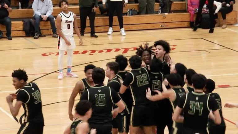 St. Patrick boys basketball celebrates on the court after beating Benet Academy.