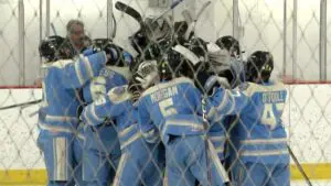 Warriors Hockey celebrates the game winner against Maine.