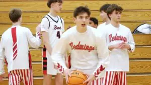 Benet Academy boys basketball players get warmed up before taking on Hope Academy on Senior Night.