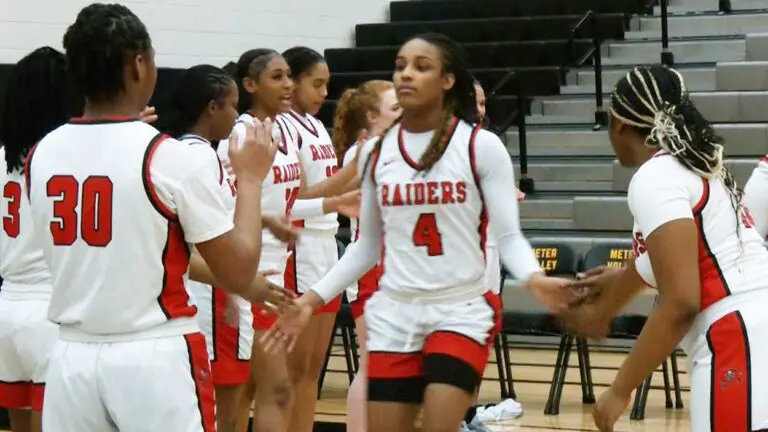 Bolingbrook girls basketball players walk out for lineup intros against Metea Valley.