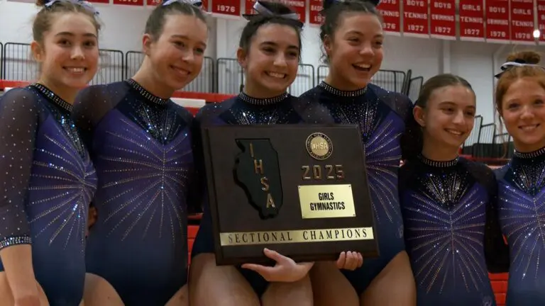 Downers Grove Co-Op with another girls gymnastics sectional plaque