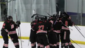 Hudson Schlie and Benet hockey celebrate after Beating York White in the Blackhawk Cup.