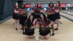 Sydney Lewis stands in the back row, third for the left for an Illinois State Bowling team picture.