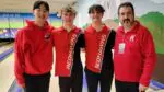 Naperville Central boys bowling seniors and coach Brian Dunn smile for a picture at the State finals.