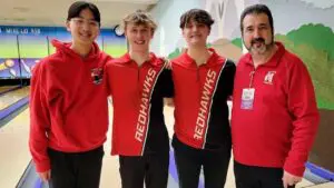 Naperville Central boys bowling seniors and coach Brian Dunn smile for a picture at the State finals.