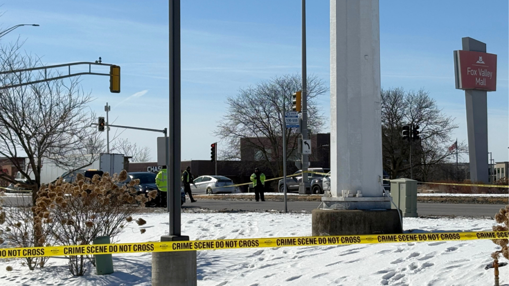 First responders at scene of collision on Route 59, with caution tape in foreground and roadway and cars in background