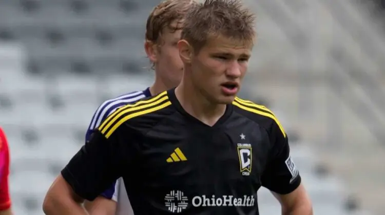 Chase Adams looks around the field in a game for the Columbus Crew 2.