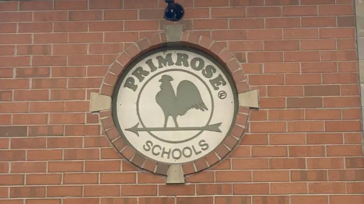 Close up Primrose School sign on brick building