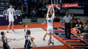 Colin Stack dunking over a defender in the IHSA Boys Basketball State Semifinals.