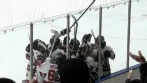 Benet Academy hockey celebrates double overtime victory over Glenbrook North