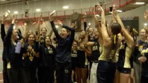 Neuqua Valley celebrates the 2025 girls track DVC indoor championship victory