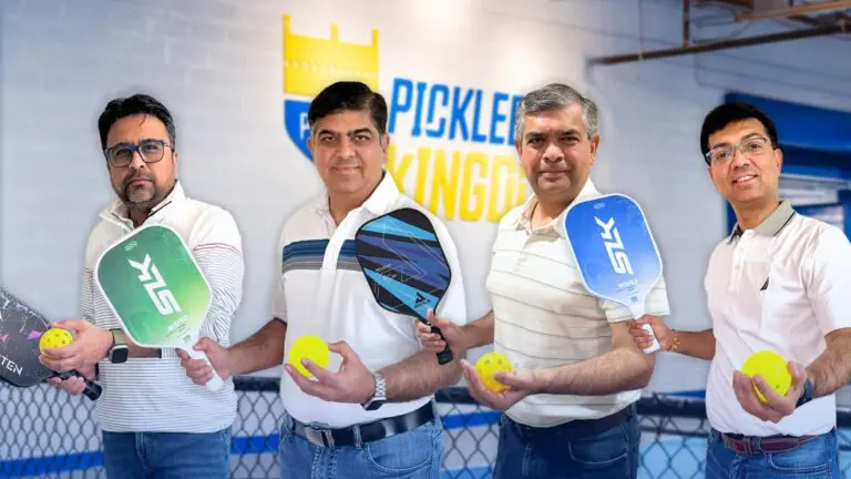 Four new Pickleball Kingdom franchise owners holding paddles and balls - From left to right: Chirdip Sheth, Saumil Parikh, Dhaval Sheth, Hemang Patel