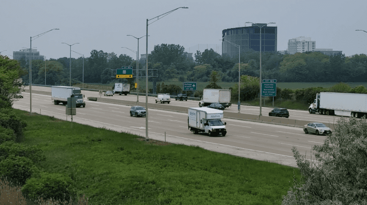 I-88 highway shot in DuPage County with business buildings in background