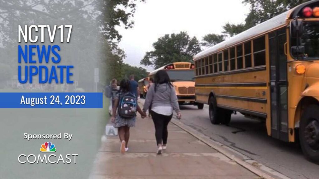 NCTV17 News Update slate for August 24, 2023 with adult and child walking on sidewalk by buses on first day of school