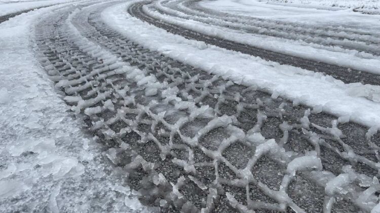 Snow and slush on street with tire marks