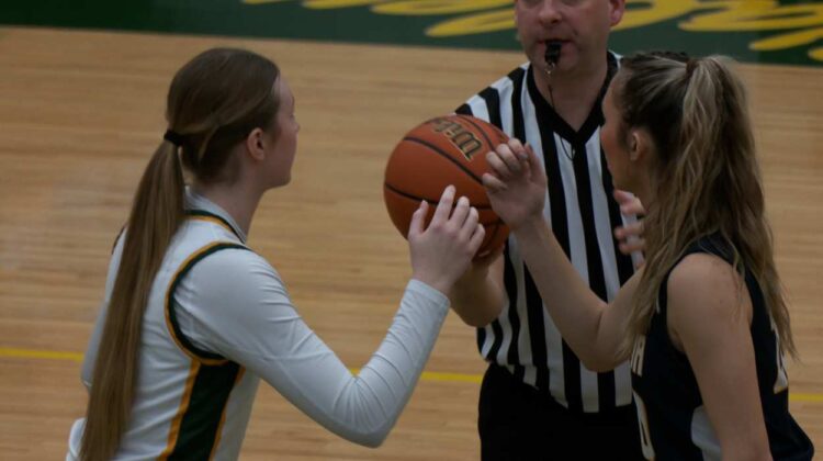 girls basketball players get ready for tipoff under previous IHSA no shot clock rules