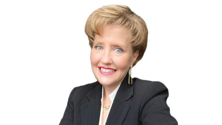 Headshot of Oasis Senior Advisors Owner Jennifer Conniff, a blond woman in a black jacket over a white background.