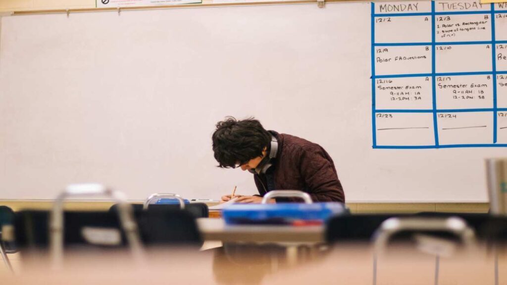 Student sitting at desk file image