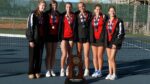 Benet girls tennis team celebrates and smiles with the IHSA State Trophy.