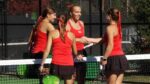 Benet girls tennis players shake hands at the sectional finals.