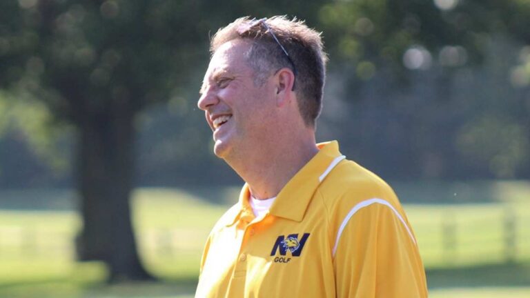 John Keller smiles while coaching a Neuqua Valley girls golf event.