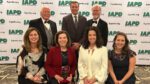 NCTV17 executive director Liz Spencer and director of marketing Jane Wernette holding the Illinois Parks' Top Journalist award