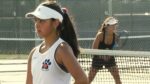 Naperville North and Neuqua Valley tennis members competing at the girls tennis DVC championships.