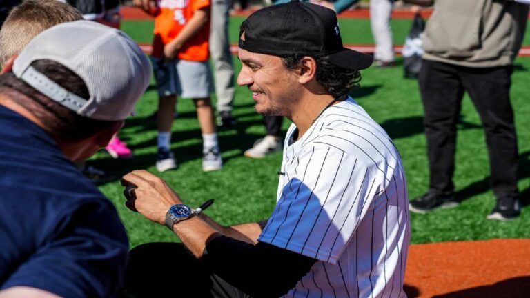 Nicky Lopez a 2024 Gold Glove Finalist, signs an autograph in Naperville