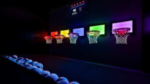 Colored, lit-up basketball hoops at Activate Games