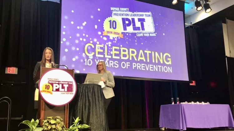 DuPage Regional Superintendent Amber Quirk, who has co-chaired the DuPage County Prevention Leadership Team for the past four years with DuPage Juvenile Probation Supervisor Jennifer Hess, right, speaks during an event celebrating 10 years of work to decrease substance misuse among teens.