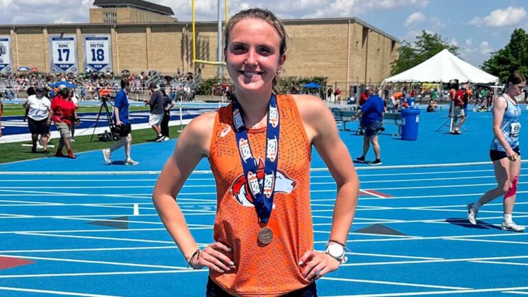 Emma Berres smiles at the 2023 IHSA State Track Meet after getting third in the 800.