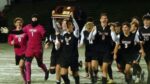 Prairie Ridge celebrate after beating Benet in boys soccer Super-Sectional.